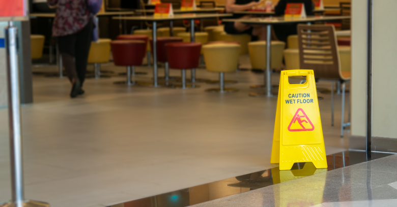 Hildebrand & Wilson, LLP in Pearland, Texas - Image of Caution Sign for Wet floor in Alvin Texas
